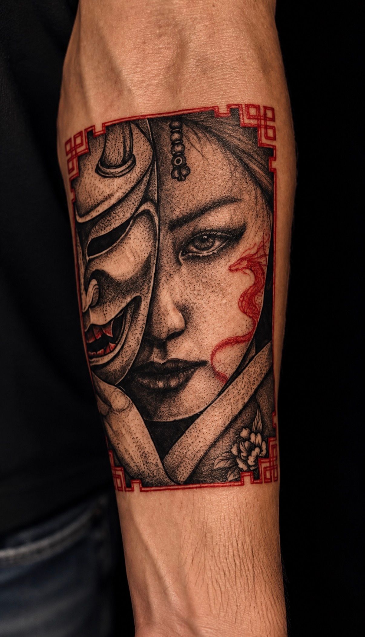 Japanese-style geisha with a hannya mask and red accents on the forearm